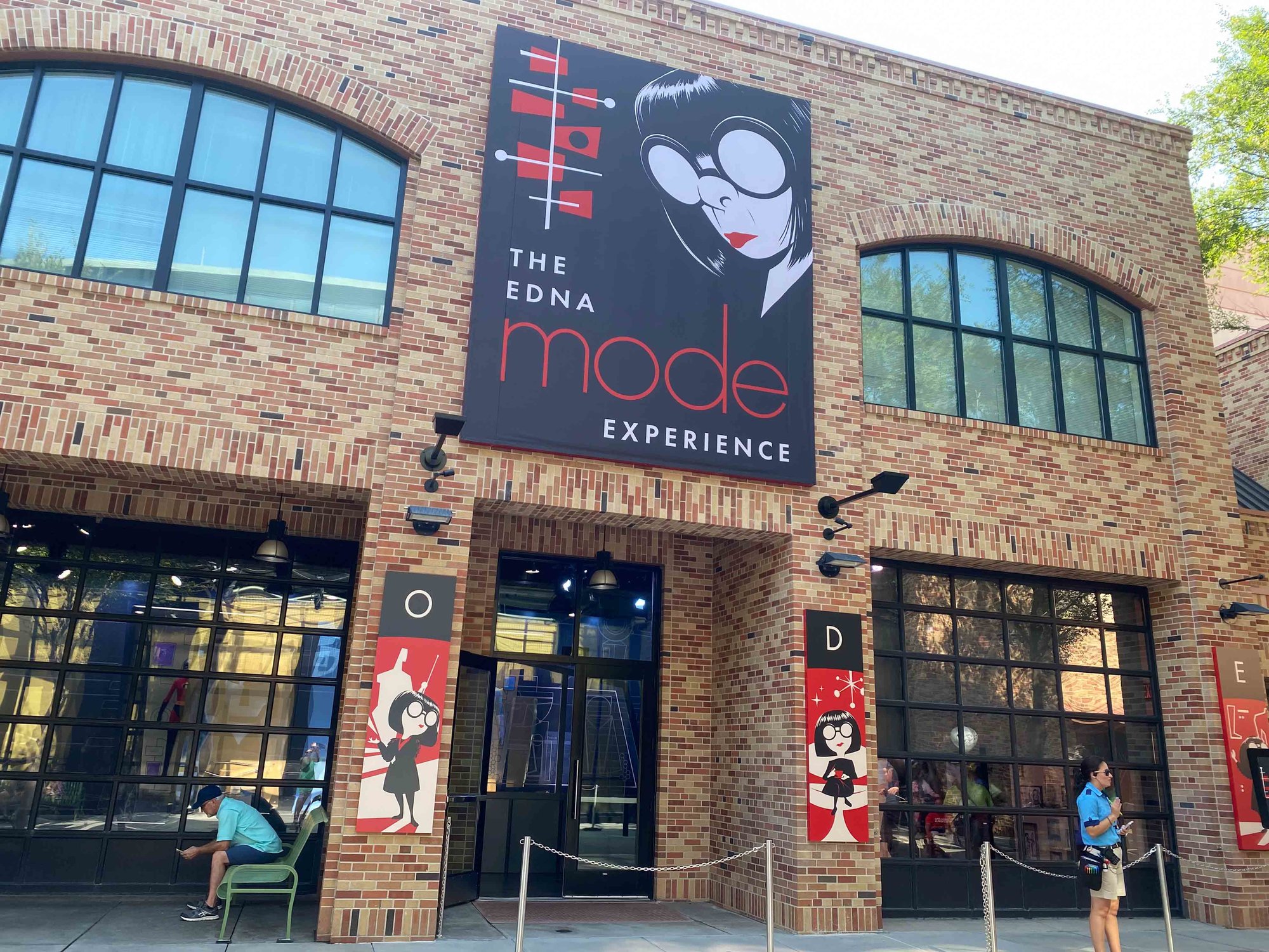edna mode experience sign and building